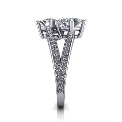 Malani oval three stone engagement ring in Platinum, side profile showing the split shank dividing into two pav&eacute; rows beneath the two-stone head
