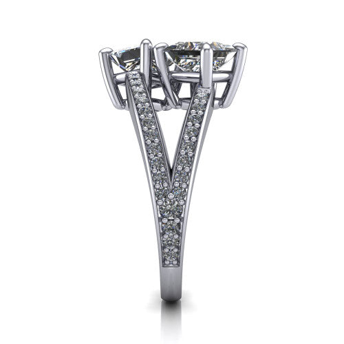 Malani princess three stone engagement ring in Platinum, side profile showing the split shank dividing into two pav&eacute; rows beneath the two-stone head