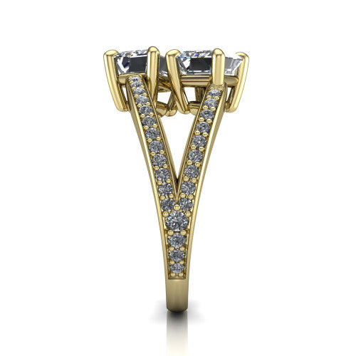 Malani emerald three stone engagement ring in 14K Yellow Gold, side profile showing the split shank dividing into two pav&eacute; rows beneath the two-stone head