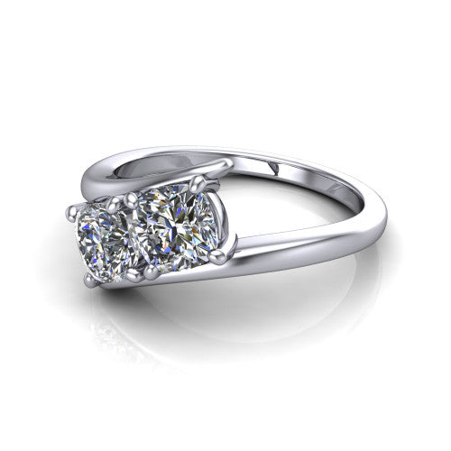 Alayna cushion three stone engagement ring in 14K White Gold, three-quarter perspective showing two diamonds set diagonally in claw baskets on a polished bypass swirl shank