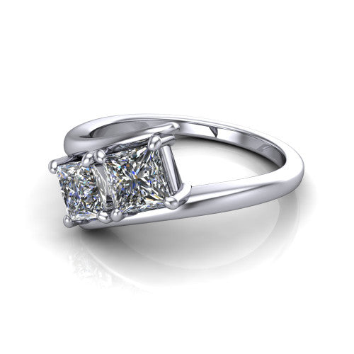 Alayna princess three stone engagement ring in 18K White Gold, three-quarter perspective showing two diamonds set diagonally in claw baskets on a polished bypass swirl shank