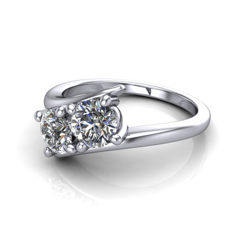 Alayna round three stone engagement ring in 14K White Gold, three-quarter perspective showing two diamonds set diagonally in claw baskets on a polished bypass swirl shank