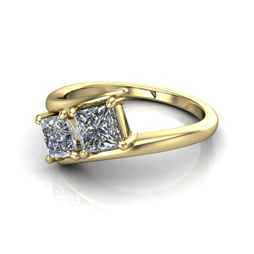 Alayna princess three stone engagement ring in 18K Yellow Gold, three-quarter perspective showing two diamonds set diagonally in claw baskets on a polished bypass swirl shank