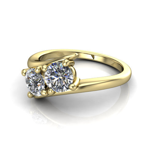 Alayna round three stone engagement ring in 18K Yellow Gold, three-quarter perspective showing two diamonds set diagonally in claw baskets on a polished bypass swirl shank