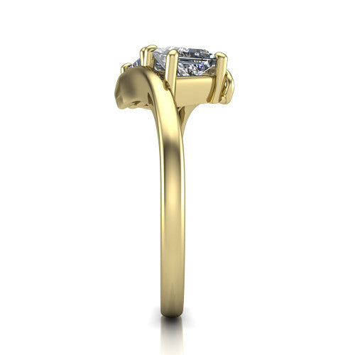Alayna princess three stone engagement ring in 14K Yellow Gold, side profile showing the bypass swirl shoulders crossing beneath the two-stone head
