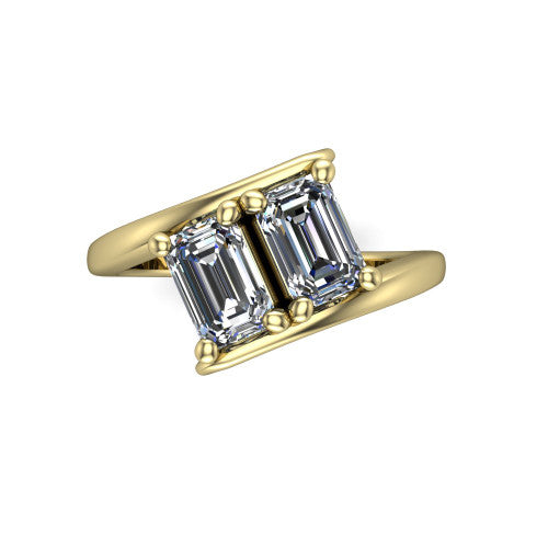 Alayna emerald three stone engagement ring in 18K Yellow Gold, top-down view showing the two diamonds set diagonally in a toi et moi arrangement above the open band