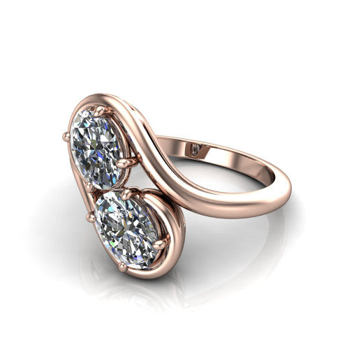 Daniela oval three stone engagement ring in 18K Rose Gold, three-quarter perspective showing two oval cut diamonds half-bezel set diagonally on a polished bypass shank
