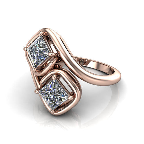 Daniela princess three stone engagement ring in 14K Rose Gold, three-quarter perspective showing two princess cut diamonds half-bezel set diagonally on a polished bypass shank