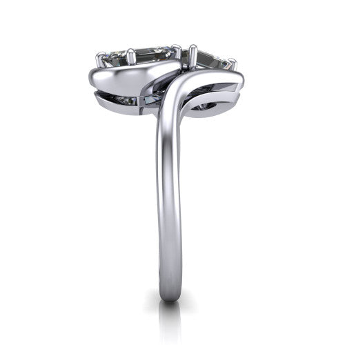 Daniela emerald three stone engagement ring in 14K White Gold, side profile showing the bypass shank sweeping up and crossing behind the two-stone head