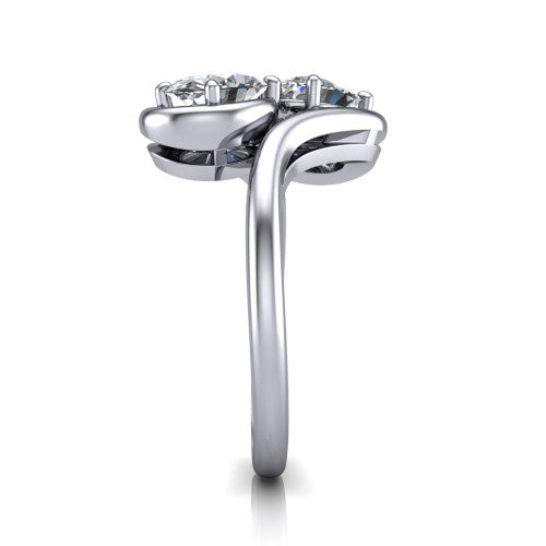 Daniela oval three stone engagement ring in Platinum, side profile showing the bypass shank sweeping up and crossing behind the two-stone head