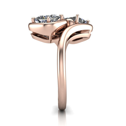 Daniela princess three stone engagement ring in 18K Rose Gold, side profile showing the bypass shank sweeping up and crossing behind the two-stone head