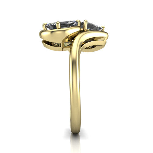 Daniela cushion three stone engagement ring in 14K Yellow Gold, side profile showing the bypass shank sweeping up and crossing behind the two-stone head