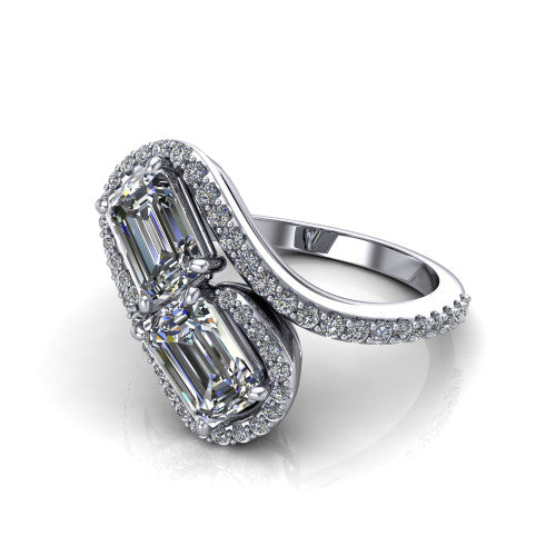 Jane emerald three stone engagement ring in 14K White Gold, three-quarter perspective showing two emerald cut diamonds set diagonally in twin square halos on a pave wraparound shank with bypass swirling shoulders