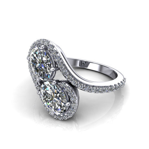 Jane oval three stone engagement ring in 14K White Gold, three-quarter perspective showing two oval cut diamonds set diagonally in twin square halos on a pave wraparound shank with bypass swirling shoulders