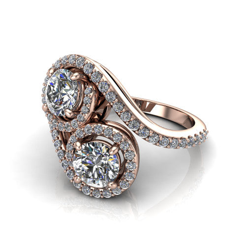Jane round three stone engagement ring in 14K Rose Gold, three-quarter perspective showing two brilliant round diamonds set diagonally in twin square halos on a pave wraparound shank with bypass swirling shoulders