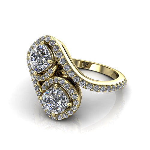Jane cushion three stone engagement ring in 14K Yellow Gold, three-quarter perspective showing two cushion cut diamonds set diagonally in twin square halos on a pave wraparound shank with bypass swirling shoulders