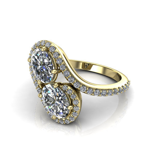 Jane oval three stone engagement ring in 18K Yellow Gold, three-quarter perspective showing two oval cut diamonds set diagonally in twin square halos on a pave wraparound shank with bypass swirling shoulders