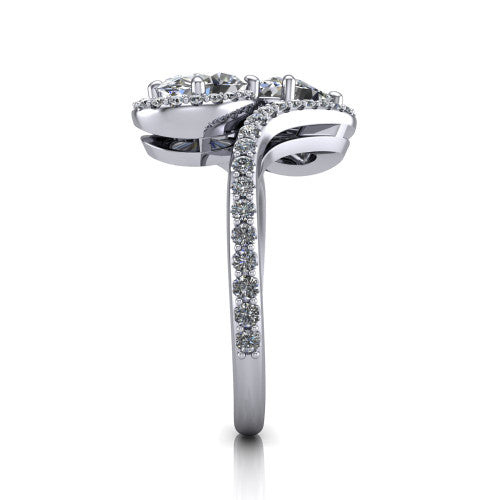Jane oval three stone engagement ring in Platinum, side profile showing the bypass swirling shoulders and pave diamonds wrapping the top and outer sides of the shank