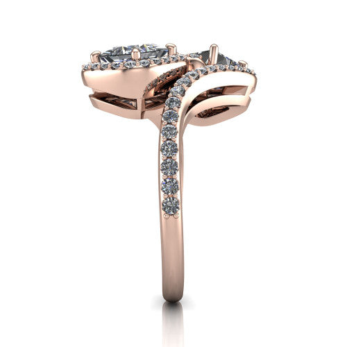 Jane princess three stone engagement ring in 18K Rose Gold, side profile showing the bypass swirling shoulders and pave diamonds wrapping the top and outer sides of the shank