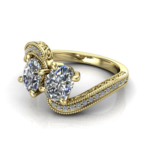 Stevie oval three stone engagement ring in 14K Yellow Gold, three-quarter perspective showing two brilliant oval diamonds set diagonally on filigree shoulders with milgrain edges and a pave center band