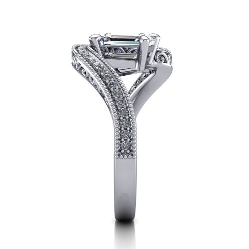 Stevie emerald three stone engagement ring in Platinum, side profile showing the engraved filigree scrolls, pave diamond center row, and milgrain bead borders along the band
