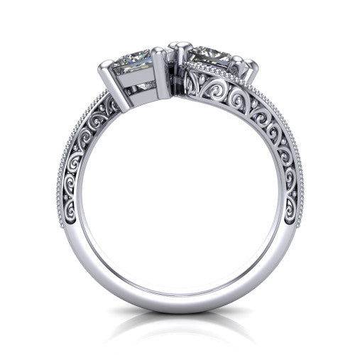 Stevie princess three stone engagement ring in 18K White Gold, through-finger front profile showing the two-stone head, filigree shoulders, milgrain band edges, and pave center row