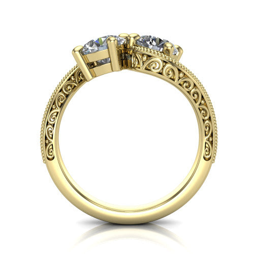 Stevie round three stone engagement ring in 14K Yellow Gold, through-finger front profile showing the two-stone head, filigree shoulders, milgrain band edges, and pave center row