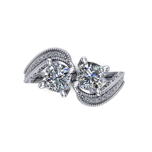 Stevie cushion three stone engagement ring in Platinum, top-down view showing two brilliant cushion-cut diamonds set diagonally in a toi et moi arrangement above filigree scrollwork shoulders and a pave band