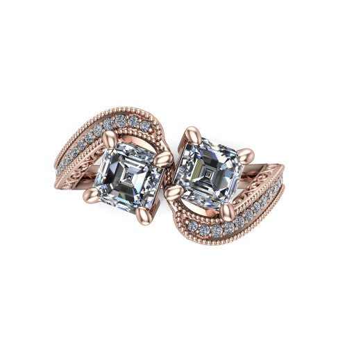 Stevie square emerald three stone engagement ring in 14K Rose Gold, top-down view showing two step-cut square emerald diamonds set diagonally in a toi et moi arrangement above filigree scrollwork shoulders and a pave band