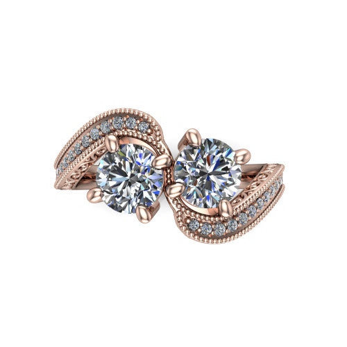 Stevie round three stone engagement ring in 14K Rose Gold, top-down view showing two brilliant round diamonds set diagonally in a toi et moi arrangement above filigree scrollwork shoulders and a pave band