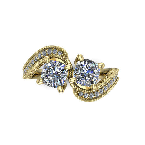 Stevie cushion three stone engagement ring in 14K Yellow Gold, top-down view showing two brilliant cushion-cut diamonds set diagonally in a toi et moi arrangement above filigree scrollwork shoulders and a pave band