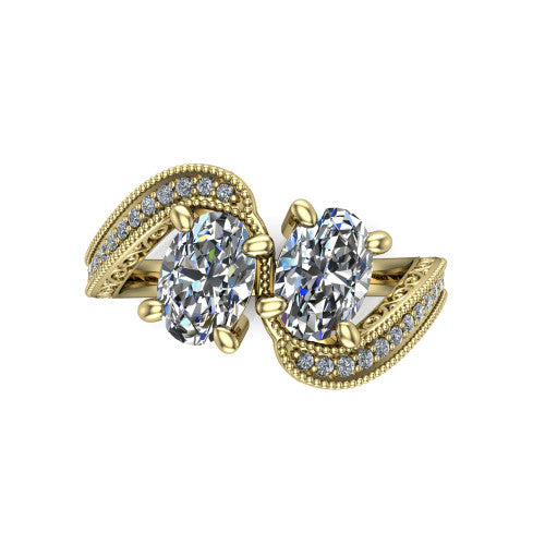 Stevie oval three stone engagement ring in 14K Yellow Gold, top-down view showing two brilliant oval diamonds set diagonally in a toi et moi arrangement above filigree scrollwork shoulders and a pave band