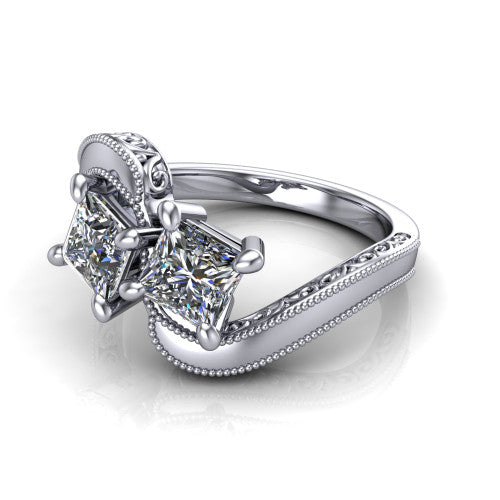 Logan princess three stone engagement ring in 14K White Gold, three-quarter perspective showing two brilliant princess-cut diamonds set diagonally on engraved filigree shoulders with milgrain edges