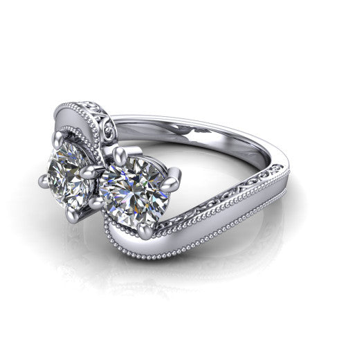 Logan round three stone engagement ring in 14K White Gold, three-quarter perspective showing two brilliant round diamonds set diagonally on engraved filigree shoulders with milgrain edges