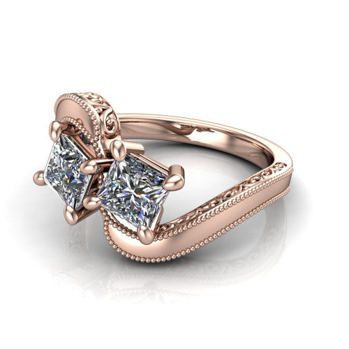 Logan princess three stone engagement ring in 18K Rose Gold, three-quarter perspective showing two brilliant princess-cut diamonds set diagonally on engraved filigree shoulders with milgrain edges
