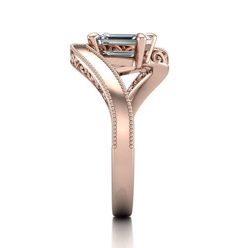 Logan emerald three stone engagement ring in 18K Rose Gold, side profile showing the hand-engraved filigree shoulders and milgrain bead borders along the band