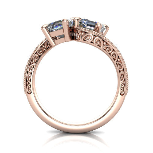 Logan square emerald three stone engagement ring in 14K Rose Gold, through-finger front profile showing the two-stone head, filigree scrollwork, and milgrain band edges