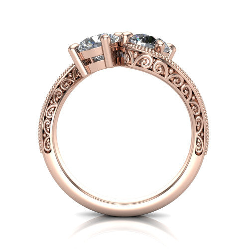 Logan round three stone engagement ring in 14K Rose Gold, through-finger front profile showing the two-stone head, filigree scrollwork, and milgrain band edges