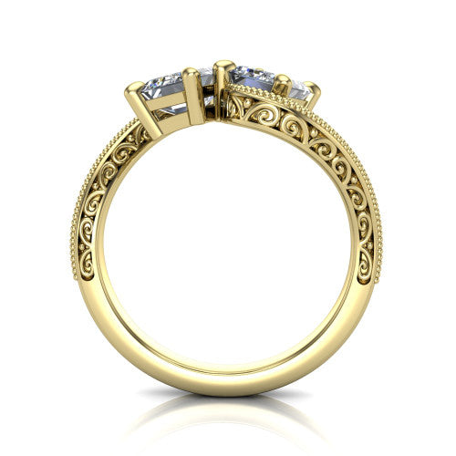 Logan emerald three stone engagement ring in 18K Yellow Gold, through-finger front profile showing the two-stone head, filigree scrollwork, and milgrain band edges