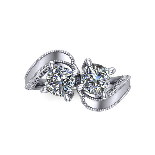 Logan cushion three stone engagement ring in 18K White Gold, top-down view showing two brilliant cushion-cut diamonds set diagonally in a toi et moi arrangement above filigree scrollwork shoulders