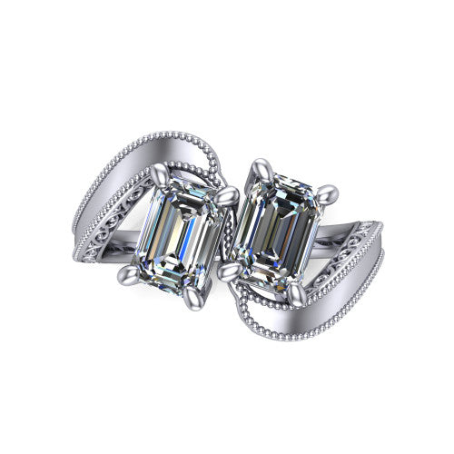 Logan emerald three stone engagement ring in 14K White Gold, top-down view showing two step-cut emerald diamonds set diagonally in a toi et moi arrangement above filigree scrollwork shoulders