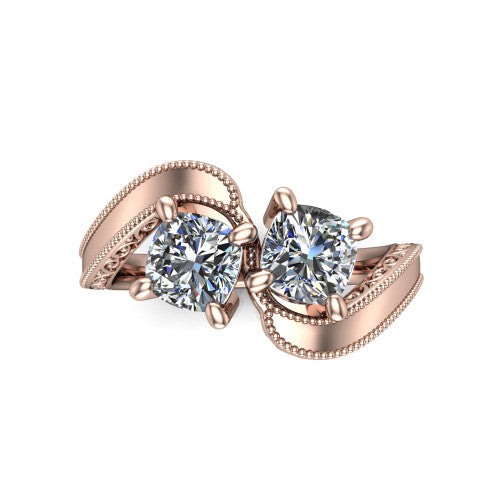 Logan cushion three stone engagement ring in 18K Rose Gold, top-down view showing two brilliant cushion-cut diamonds set diagonally in a toi et moi arrangement above filigree scrollwork shoulders