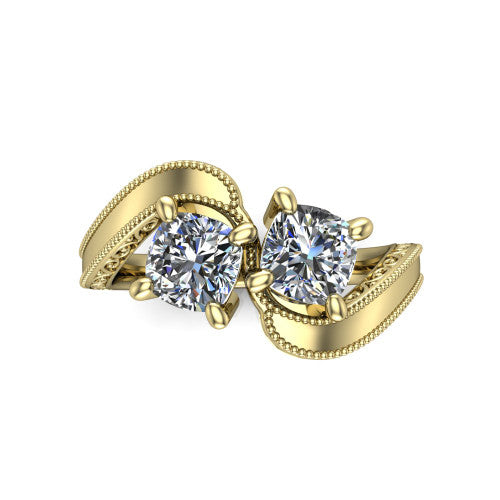 Logan cushion three stone engagement ring in 14K Yellow Gold, top-down view showing two brilliant cushion-cut diamonds set diagonally in a toi et moi arrangement above filigree scrollwork shoulders