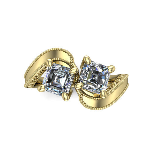 Logan square emerald three stone engagement ring in 18K Yellow Gold, top-down view showing two step-cut square emerald diamonds set diagonally in a toi et moi arrangement above filigree scrollwork shoulders