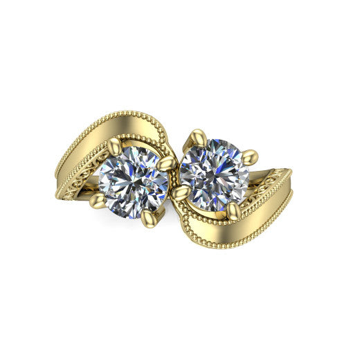 Logan round three stone engagement ring in 18K Yellow Gold, top-down view showing two brilliant round diamonds set diagonally in a toi et moi arrangement above filigree scrollwork shoulders