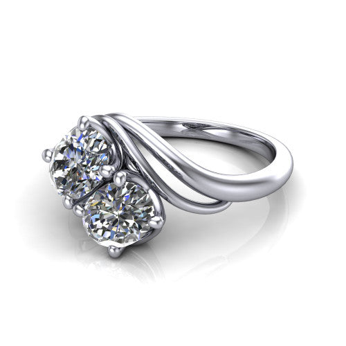 Julianna oval three stone engagement ring in Platinum, three-quarter perspective showing two brilliant oval diamonds set diagonally on multi-ribbon wrapping shoulders