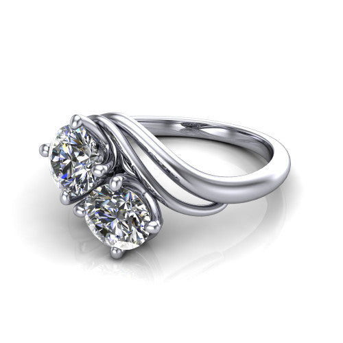 Julianna round three stone engagement ring in 18K White Gold, three-quarter perspective showing two brilliant round diamonds set diagonally on multi-ribbon wrapping shoulders