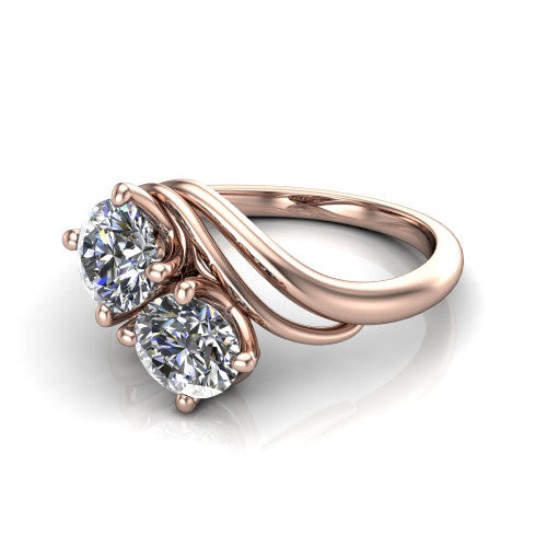 Julianna round three stone engagement ring in 18K Rose Gold, three-quarter perspective showing two brilliant round diamonds set diagonally on multi-ribbon wrapping shoulders