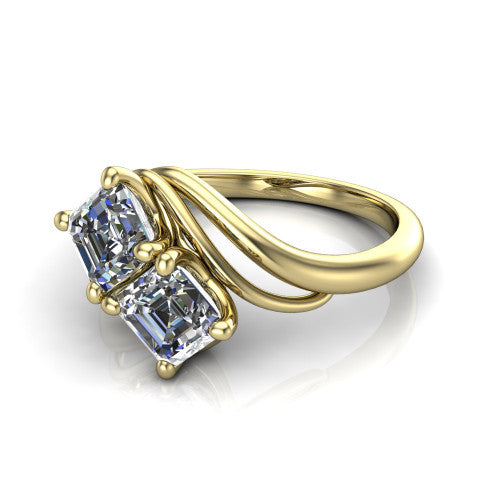 Julianna square emerald three stone engagement ring in 18K Yellow Gold, three-quarter perspective showing two step-cut square emerald diamonds set diagonally on multi-ribbon wrapping shoulders