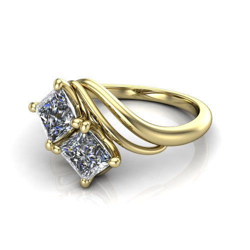 Julianna princess three stone engagement ring in 18K Yellow Gold, three-quarter perspective showing two brilliant princess-cut diamonds set diagonally on multi-ribbon wrapping shoulders